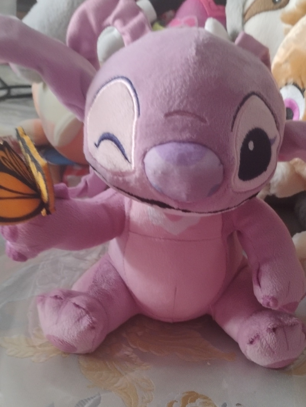 Pink Stitch-Inspired Plush Toy with Butterfly Accessory